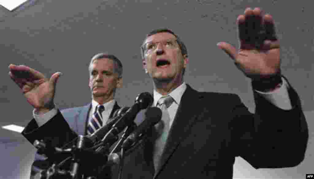 Debt Commission members, Senate Budget Committee Chairman Sen. Kent Conrad, D-N.D., right, accompanied by the committee's ranking Republican Sen. Judd Gregg, R-N.H., speaks on Capitol Hill in Washington Wednesday, Dec. 1, 2010, after a meeting of the com