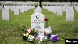 The grave of Army Captain Humayun Khan is seen adorned with flowers at Arlington National Cemetery in Arlington, Virginia, Aug. 1, 2016. 