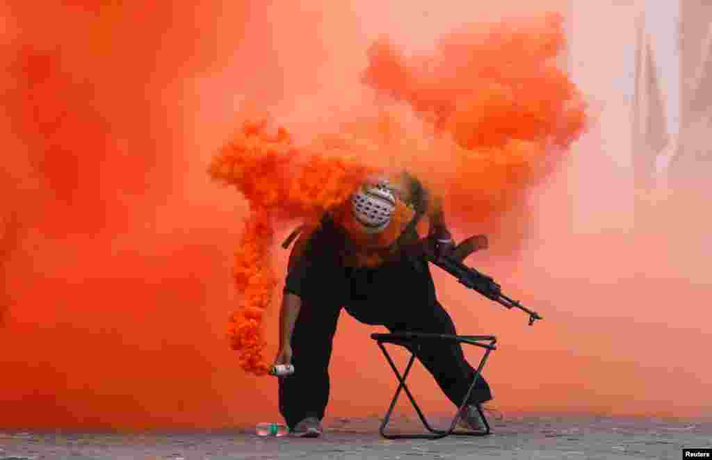 An Indian Navy member attends a military exercise during Navy Day celebrations in Mumbai.