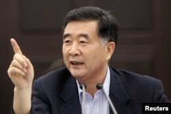 FILE PHOTO: Wang Yang, Guangdong's Communist Party leader, speaks during a news conference in Guangzhou