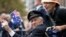 FILE - A veteran is pushed in a wheelchair during the ANZAC Day parade, in Sydney, Friday, April 25, 2014, commemorating the anniversary of the first major military action fought by Australian and New Zealand Army Corps (ANZAC) during the First World War.