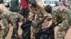 Soldiers cleaning up the streets of Juba, Oct. 27, 2018.