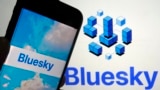 In this file photo, the app for Bluesky is shown on a mobile phone, left, and on a laptop screen on June 2, 2023, in New York. (AP Photo/Richard Drew, File)