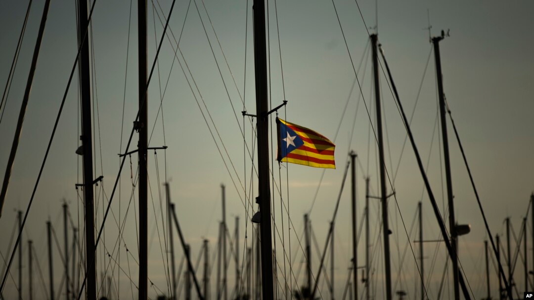 FILE - A Catalonia independence flag waves on a mast of a boat at the port of Vilanova i La Geltru, Spain, Oct. 31, 2017. 