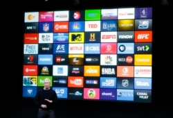 FILE - Apple CEO Tim Cook speaks about the Apple TV during an event at Apple headquarters in Cupertino, California, March 21, 2016.