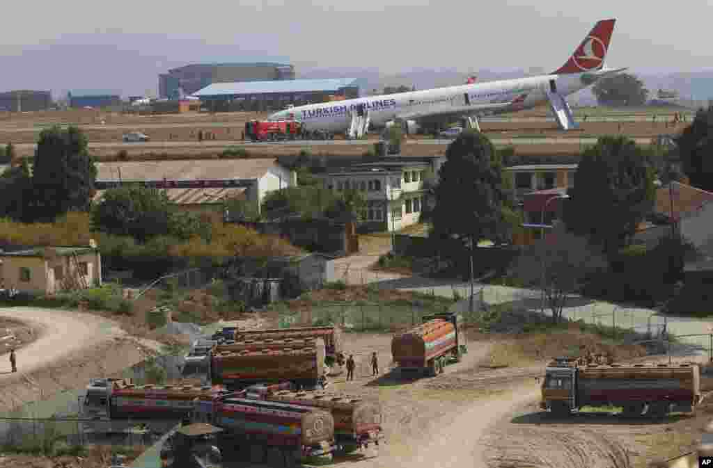 A Turkish Airlines jet that skidded off a slippery runway while landing in dense fog is seen at Tribhuwan International Airport in Kathmandu, Nepal.The plane with 238 people on board was coming from Istanbul. Officials said passengers suffered bruises but no serious injuries. &nbsp;