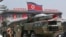 FILE - A North Korean missile is carried by a military vehicle during a parade in Pyongyang.