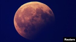 FILE - A partial lunar eclipse is pictured in Berlin, Germany, August 7, 2017. 