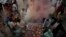 Pakistani Hindus celebrate Holi, festival of colors in Lahore, Pakistan, in 2012. The Hindus who got alcohol poisoning consumed the hooch during preparations for Holi celebrations, which will begin Wednesday.