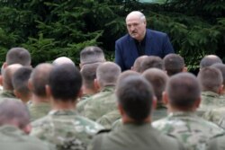 FILE - Belarusian President Alexander Lukashenko speaks during a meeting with security and law enforcement leaders in Minsk, Belarus, Aug. 21, 2020.