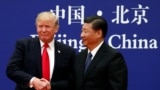 U.S. President Donald Trump and China's President Xi Jinping meet business leaders at the Great Hall of the People in Beijing, Nov. 9, 2017. 