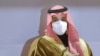 FILE - Saudi Crown Prince Mohammed bin Salman wears a face mask to help curb the spread of the coronavirus as he attends the Saudi Cup, at King Abdul Aziz race track in Riyadh, Saudi Arabia, Feb. 20, 2021.