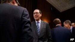 AT&T Chairman and CEO Randall Stephenson waits for the start of a Senate Judiciary subcommittee hearing on the proposed merger between AT&T and Time Warner on Capitol Hill in Washington, Dec. 7, 2016.