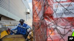 Offloading Ebola relief supplies from Direct Relief to aid in response efforts. (PRNewsFoto/Direct Relief) 