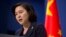 FILE - Chinese Foreign Ministry spokeswoman Hua Chunying speaks during a briefing at the Chinese Foreign Ministry in Beijing.