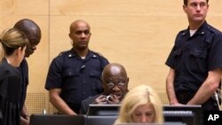 Former Ivory Coast President Laurent Gbagbo, back row center, attends confirmation of charges hearing, International Criminal Court, The Hague, Netherlands, Feb. 19, 2013.