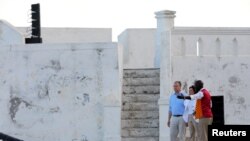 Guide Kwesi Blankson leads U.S. Vice President Kamala Harris and second gentleman Doug Emhoff as they tour the Cape Coast slave castle during her week-long trip to Ghana, Tanzania and Zambia, in Cape Coast, Ghana, March 28, 2023. 