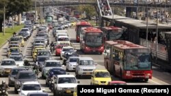 FILE - Cars and public buses are seen in a traffic jam in Bogota, Columbia October 20, 2015. The city topped the list as the most congested city, with drivers losing 191 hours a year. (REUTERS/Jose Miguel Gomez/File Photo)