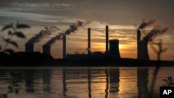 FILE - The coal-fired Plant Scherer, one of the top carbon dioxide emitters in the U.S., is seen in Juliette, Georgia, June, 3, 2017. Americans want 'aggressive' action on climate change but few see it as a priority, a poll has found.