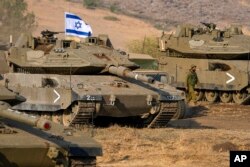 Izraelski tenkovi stacionirani nedaleko od granice sa Libanom, 11. oktobra 2023.