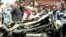 A destroyed car at scene of car bomb explosion in Benghazi, Libya, May 13, 2013