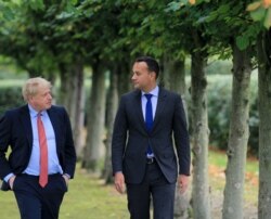 Ireland's Prime Minister, Leo Varadkar, right, and Britain's Prime Minister Boris Johnson pose for a photograph at Thornton Manor Hotel, Oct. 10, 2019, as they met for Brexit talks.