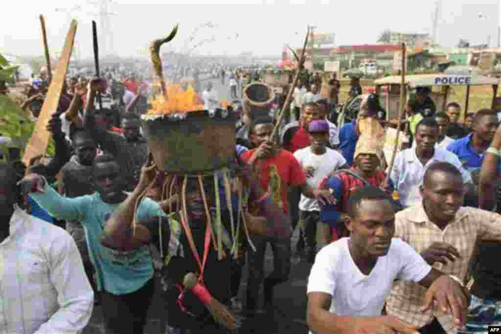 Angry youths protest on day five of a nationwide strike following the removal of a fuel subsidy by the government in Lagos, Nigeria, Friday, Jan. 13, 2012. Unions in Nigeria announced Friday a weekend pause in a paralyzing national strike amid new negotia