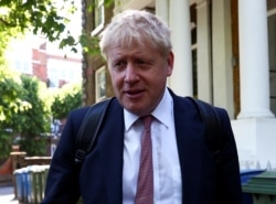 FILE - Former British Foreign Secretary Boris Johnson, who is running to succeed Theresa May as prime minister, leaves his home in London, May 30, 2019.