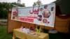 FILE - A worker sits in stall set up by the charity Falah-e-Insaniat Foundation, waiting for donations for Indian Kashmiris, in Islamabad, Pakistan, Aug. 2, 2016. FIF is a U.S.- and U.N.-designated terror group.