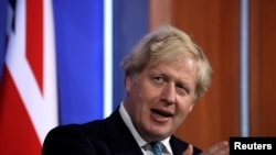 Britain's Prime Minister Boris Johnson speaks at a news conference about the ongoing coronavirus disease (COVID-19) outbreak, in London, May 14, 2021. 