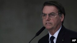 Brazil's President Jair Bolsonaro speaks during ceremony at the Planalto Presidential Palace in Brasilia, Brazil, March 25, 2019. 