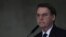 FILE - Brazil's President Jair Bolsonaro speaks during ceremony at the Planalto Presidential Palace in Brasilia, Brazil, March 25, 2019. 