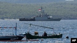 Indonesian Navy ship KRI Singa sails to take part in the search for submarine KRI Nanggala that went missing while participating in a training exercise on Wednesday, off Banyuwangi, East Java, Indonesia, Thursday, April 22, 2021. (AP Photo)