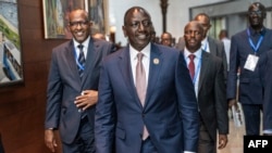 President of Kenya William Ruto, center, arrives for the 37th Ordinary Session of the Assembly of the African Union in Addis Ababa, Feb. 18, 2024. 
