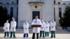 U.S. Navy Commander Dr. Sean Conley, the White House physician, is flanked by other doctors as he speaks to the media, at Walter Reed National Military Medical Center in Bethesda, Maryland, Oct. 4, 2020.