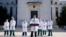U.S. Navy Commander Dr. Sean Conley, the White House physician, is flanked by other doctors as he speaks to the media, at Walter Reed National Military Medical Center in Bethesda, Maryland, Oct. 4, 2020.
