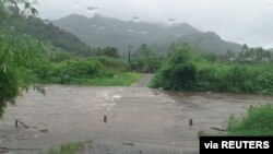 The Bagata Crossing floods on Vunivesi Road in Savusavu, as Cyclone Yasa passes through Fiji, Dec. 17, 2020, in this photo obtained from social media. 