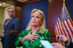 Rep. Debbie Dingell, D-Mich., talks with reporters at the Capitol in Washington, June 15, 2021.