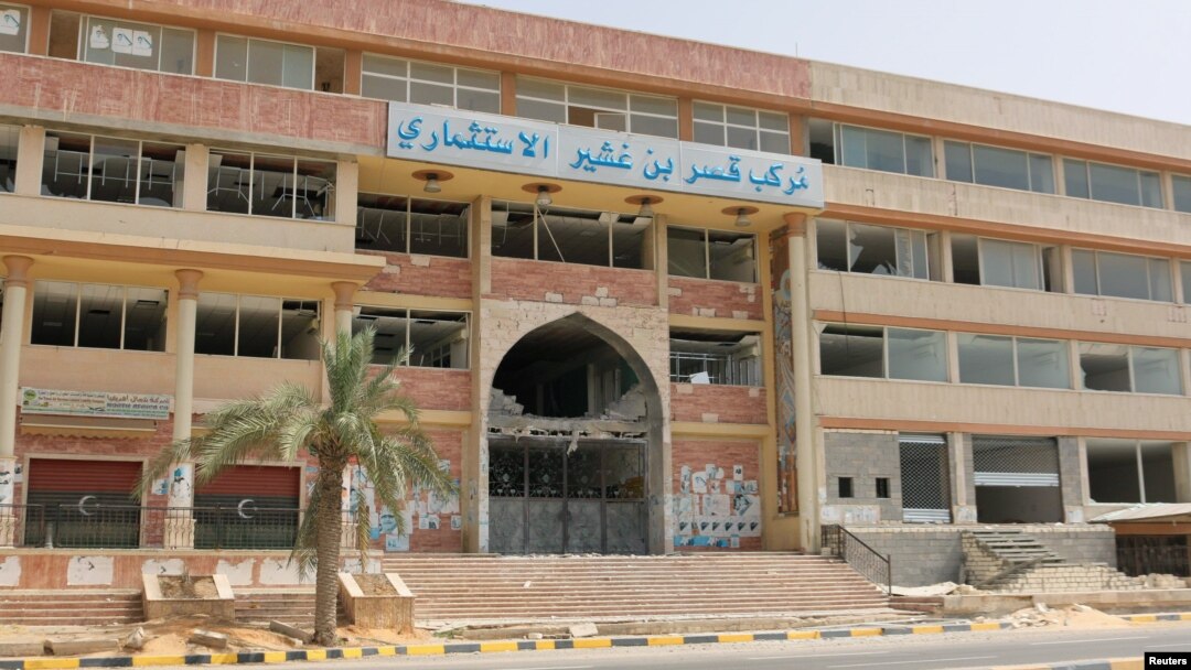 A damaged building is pictured after a shelling in Qaser Bin Ghashir, near the Tripoli International Airport, July 26, 2014. 