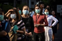 People line up to buy face masks amid concerns about the spread of the coronavirus, outside a shopping mall in Bangkok, Thailand, March 5, 2020.