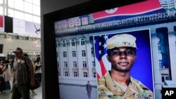 FILE - A TV screen shows a file image of American soldier Travis King during a news program at the Seoul Railway Station in Seoul, South Korea on Aug. 16, 2023. 