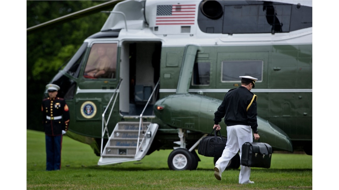 A military aid carries a suitcase with nuclear codes while accompanying President Barack Obama to Marine One of the South Lawn of the White House on May 21, 2016 in Washington.
