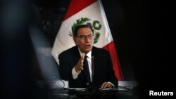 Peru's President Martin Vizcarra speaks to foreign media at the government palace in Lima, Oct. 29, 2018. 