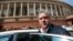FILE - Indian business tycoon Vijay Mallya gets into his car outside the Parliament in New Delhi, India, Feb. 27, 2013.