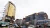 FILE - People walk through the streets of a shopping area in Addis Ababa, May 26, 2014. 