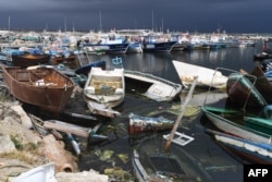 FILE—The remains of boats used by migrants to cross the Mediterranean to reach Europe are scattered along the port of El-Amra in Tunisia's Sfax governorate on April 24, 2024.