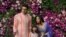 FILE - Actor Abhishek Bachchan, his wife actress Aishwarya Rai Bachchan and their daughter Aaradhya pose for a photo at a wedding at Bandra-Kurla Complex in Mumbai, India, March 9, 2019.