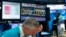 A trader holds his hand to his head after trading was halted for the day at the New York Stock Exchange, March 18, 2020, in New York. Remove