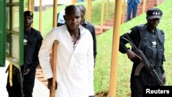 FILE—Kyoto Abdul Rashid aka Njovu, 31, a commander of the militant Allied Democratic Forces (ADF), arrives at the Chief Magistrate Court where he was charged with nine offenses including the murder of tourists in Uganda's Queen Elizabeth National Park, in Uganda November 13, 2023