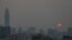 The sun is seen through evening air pollution in Bangkok, Thailand, Feb. 8, 2018.